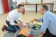 Two men discussing defibrillator training
